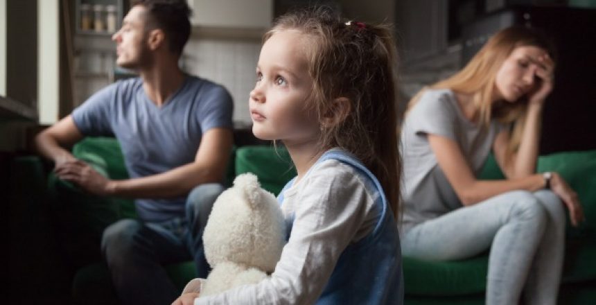 Upset frustrated little girl tired of parent fight, toddler daughter holding toy dreaming that family conflicts would stop, suffering from mother and father quarrels, bad family relationship, break up